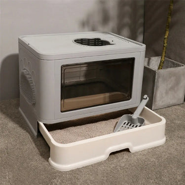 KittyNook Cat Co. Purrfect Foldable Litter Solution—dual entry, pull-out tray, on carpet for easy cleanup.